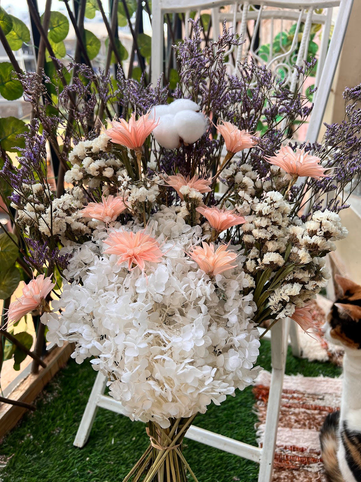 Bouquet of flowers with white and pink flowers on a grassy background