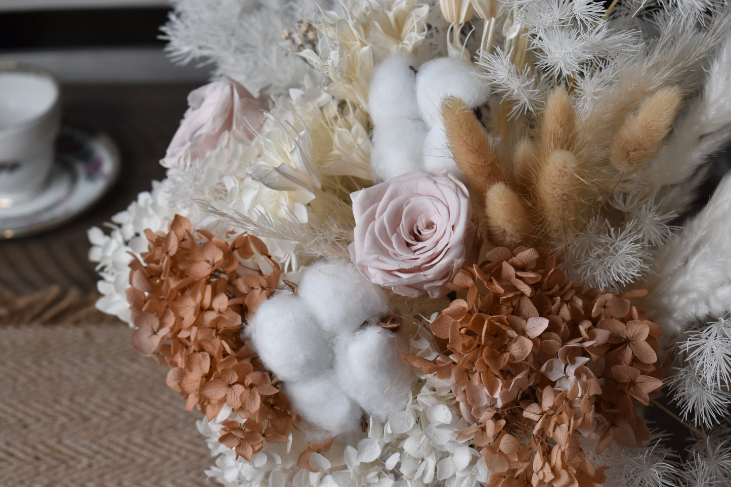 The Issadora muted nude colours preserved flower arrangement close-up.