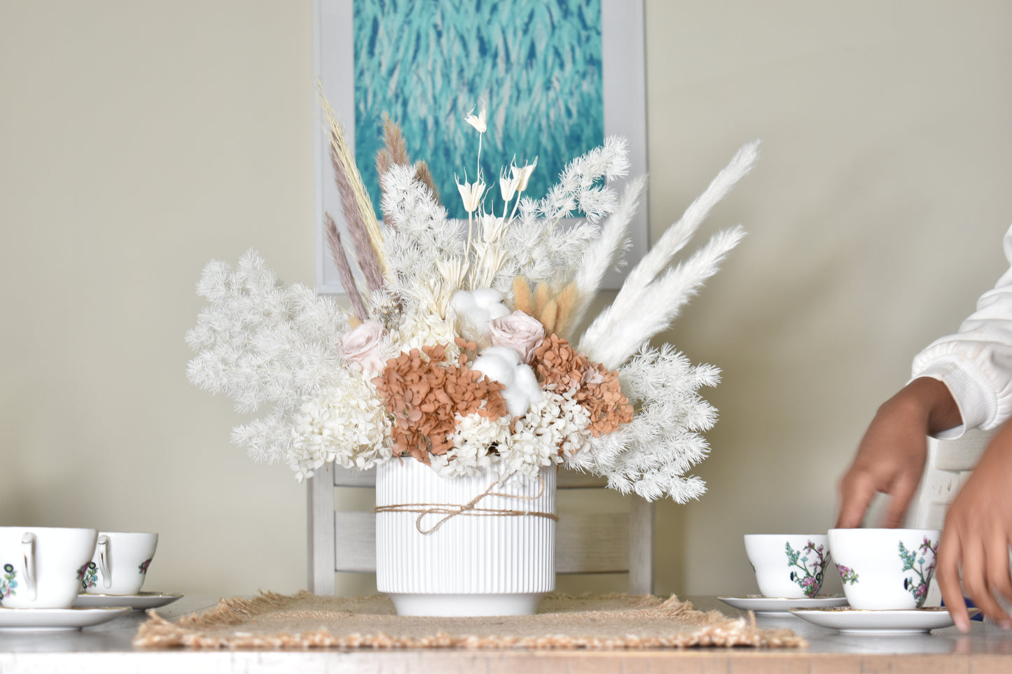 The Issadora muted nude colours preserved flower arrangement from kenyan lady fleur on dining table.