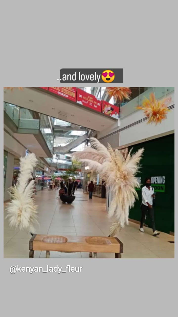 Beige and white pampas grass from kenyan lady fleur flower shop setup at the village market, nairobi.