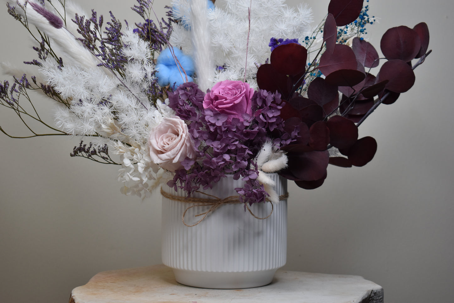 Dried flowers arrangement set from kenyan lady fleur on soapstone in the hallway.