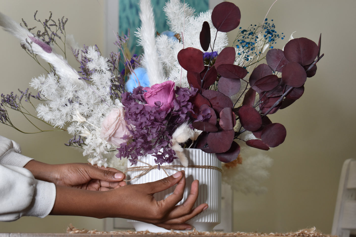 Dried flowers arrangement set from kenyan lady fleur on dining table.