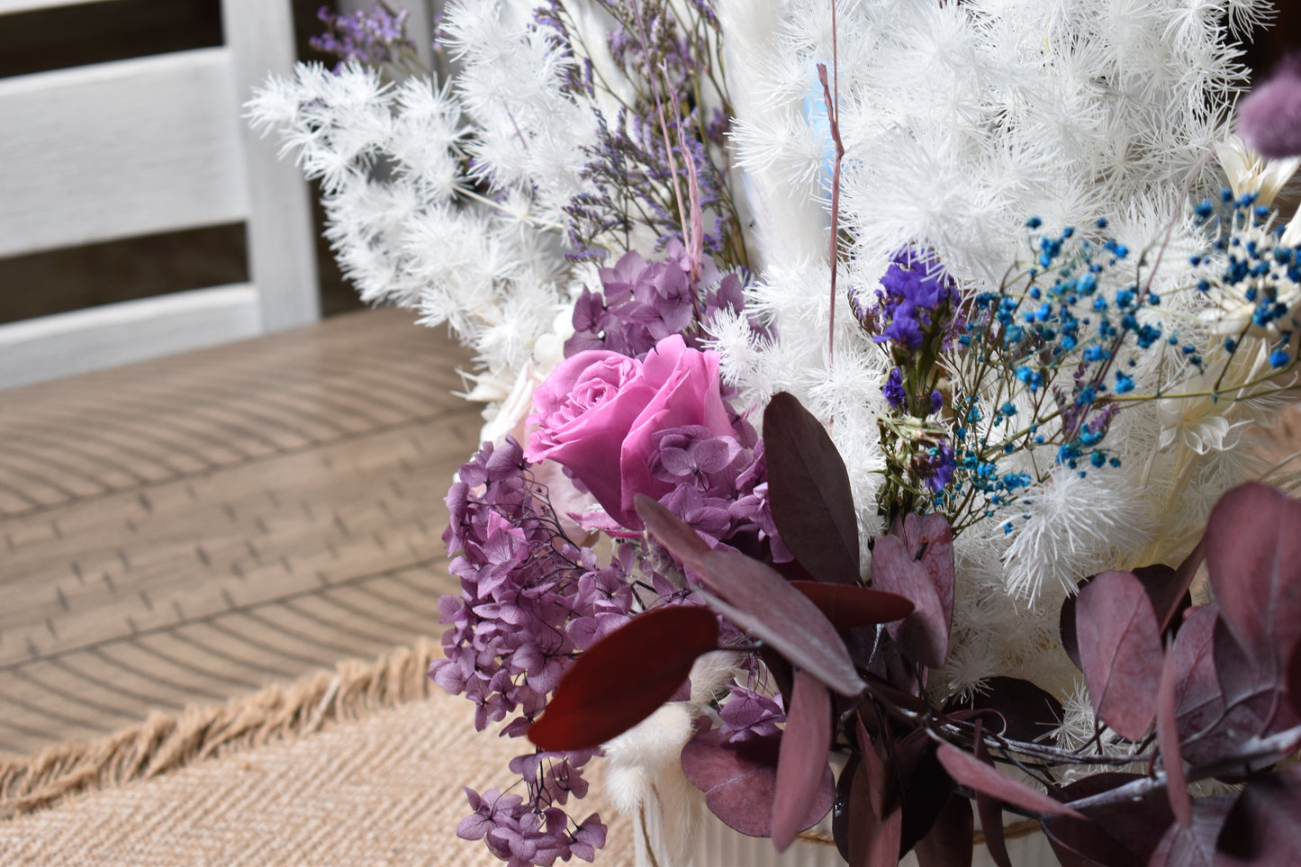 Dried flowers arrangement from kenyan lady fleur contains preserved roses, eucalyotus, hydrangea, penglai pine, caspia, statice, babys breath, bunny tails, cotton stems and star anise.