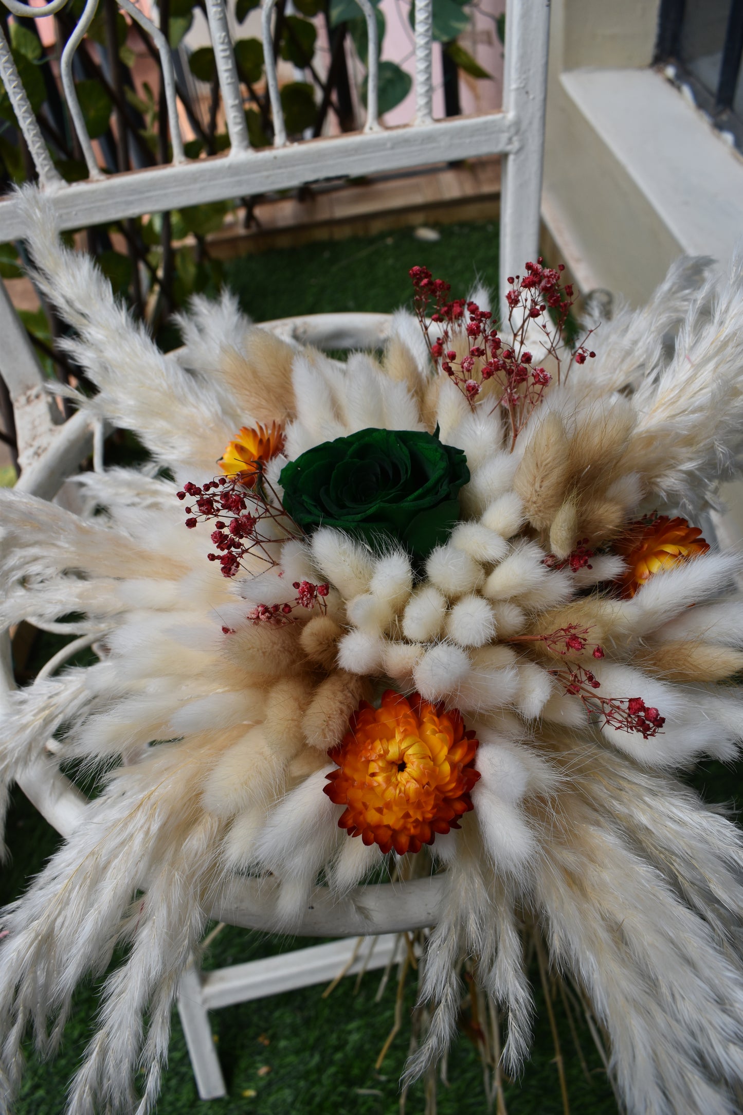 Decorative dried flowers bouquet Kenya with pampas grass, bunny tails, dried baby's breath, everlastings, and green star anise in a vase all from kenyan lady fleur-KLF
