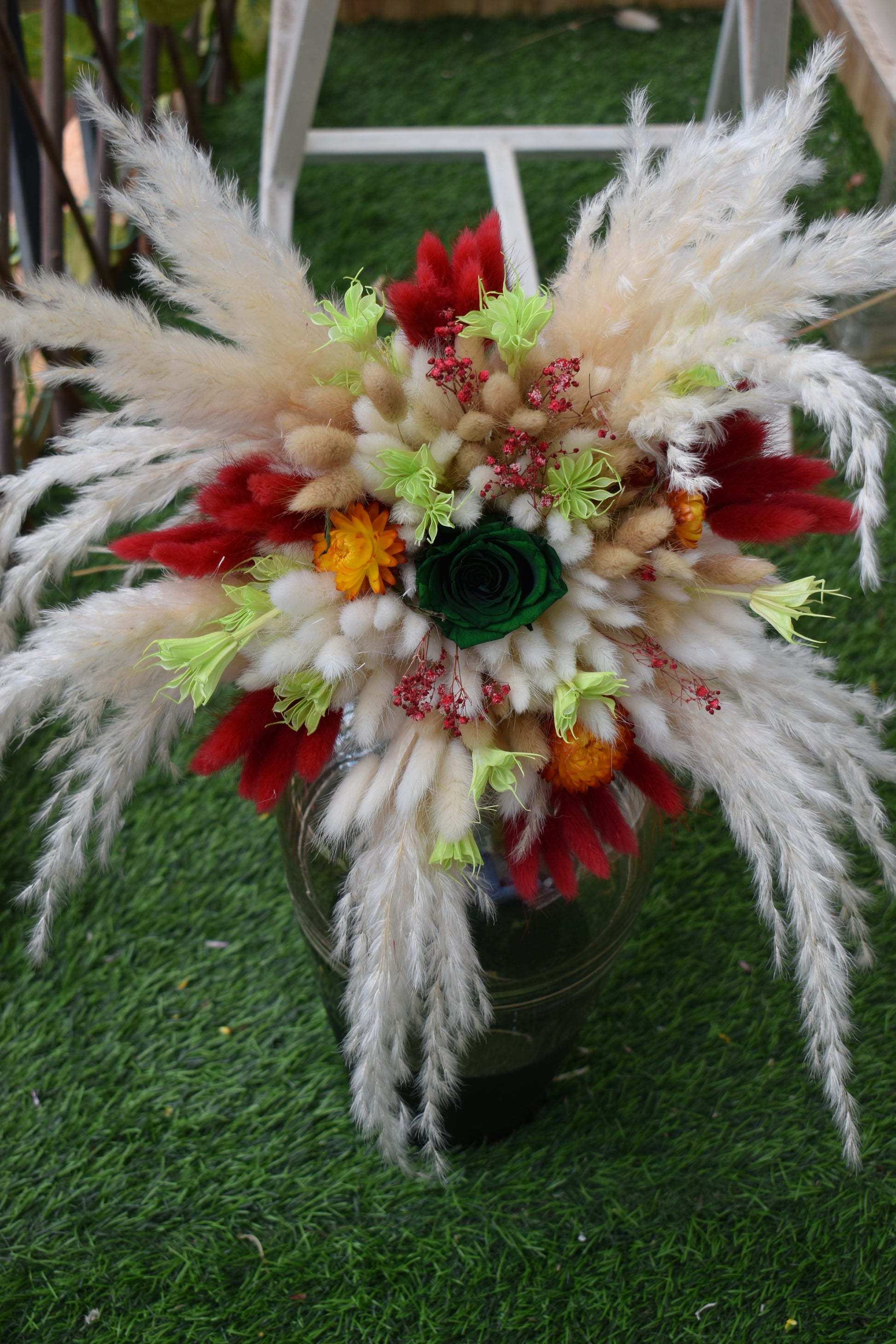 Decorative dried flowers bouquet Kenya with pampas grass, bunny tails, dried baby's breath, everlastings, and green star anise in a vase all from kenyan lady fleur-KLF