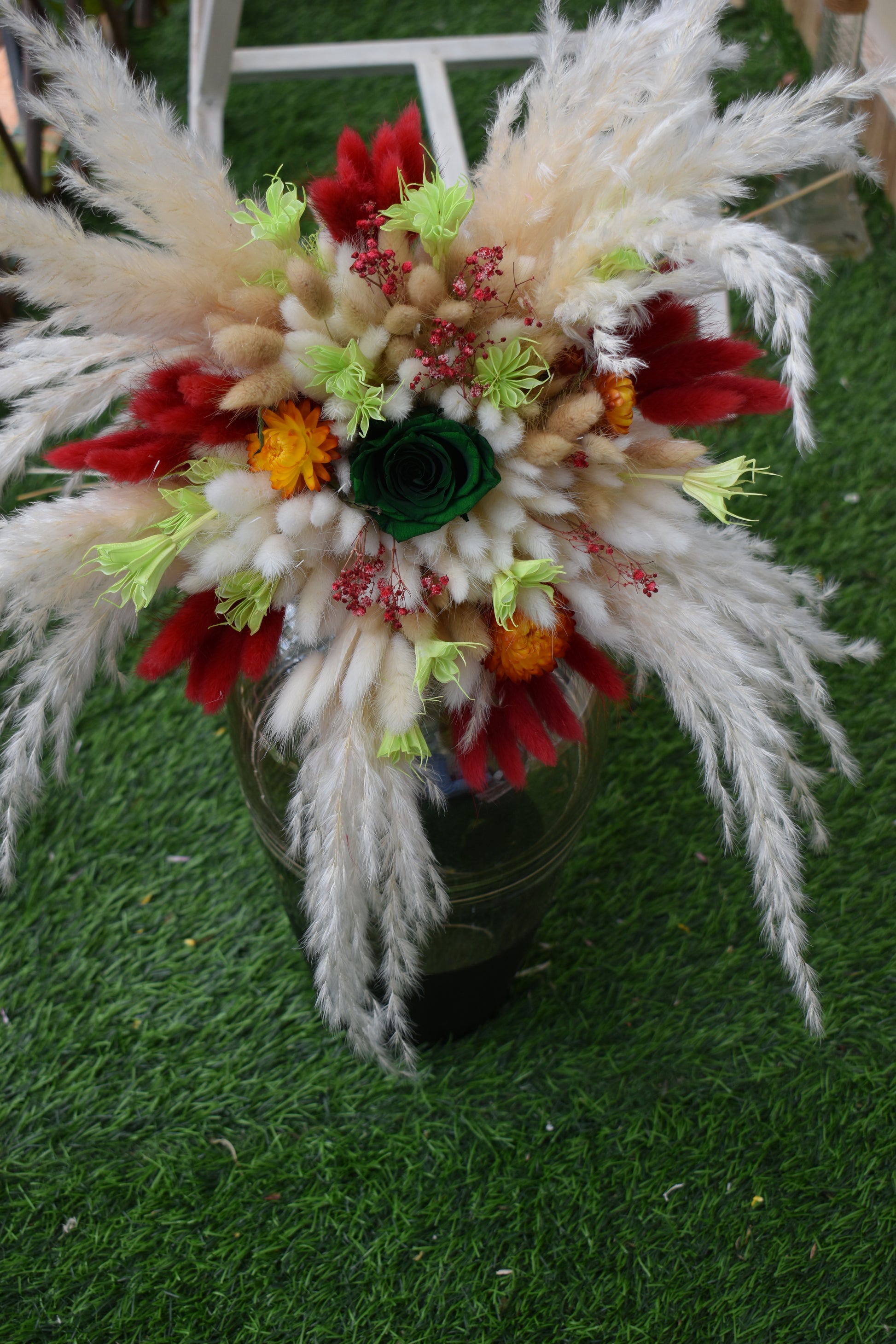 Decorative dried flowers bouquet Kenya with pampas grass, bunny tails, dried baby's breath, everlastings, and green star anise in a vase all from kenyan lady fleur-KLF.