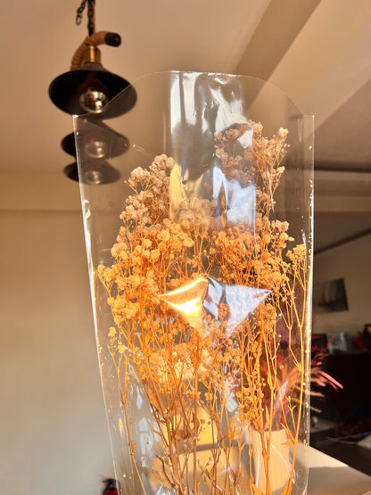 Dried floral arrangement featuring a large cascading bunch of cream white preserved baby's breath from kenyan lady fleur of dried flowers kenya in colourless packaging. 