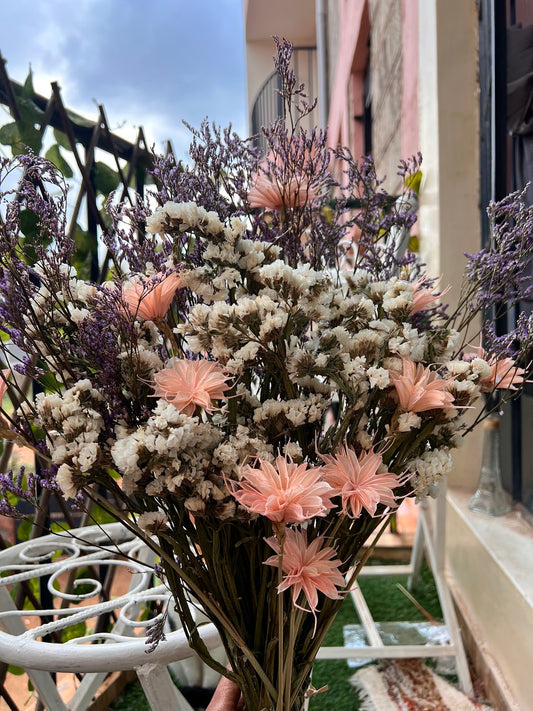 Dried flower bouquet made of white statice, purple caspia, and Star Anise in peach from kenyan lady fleur