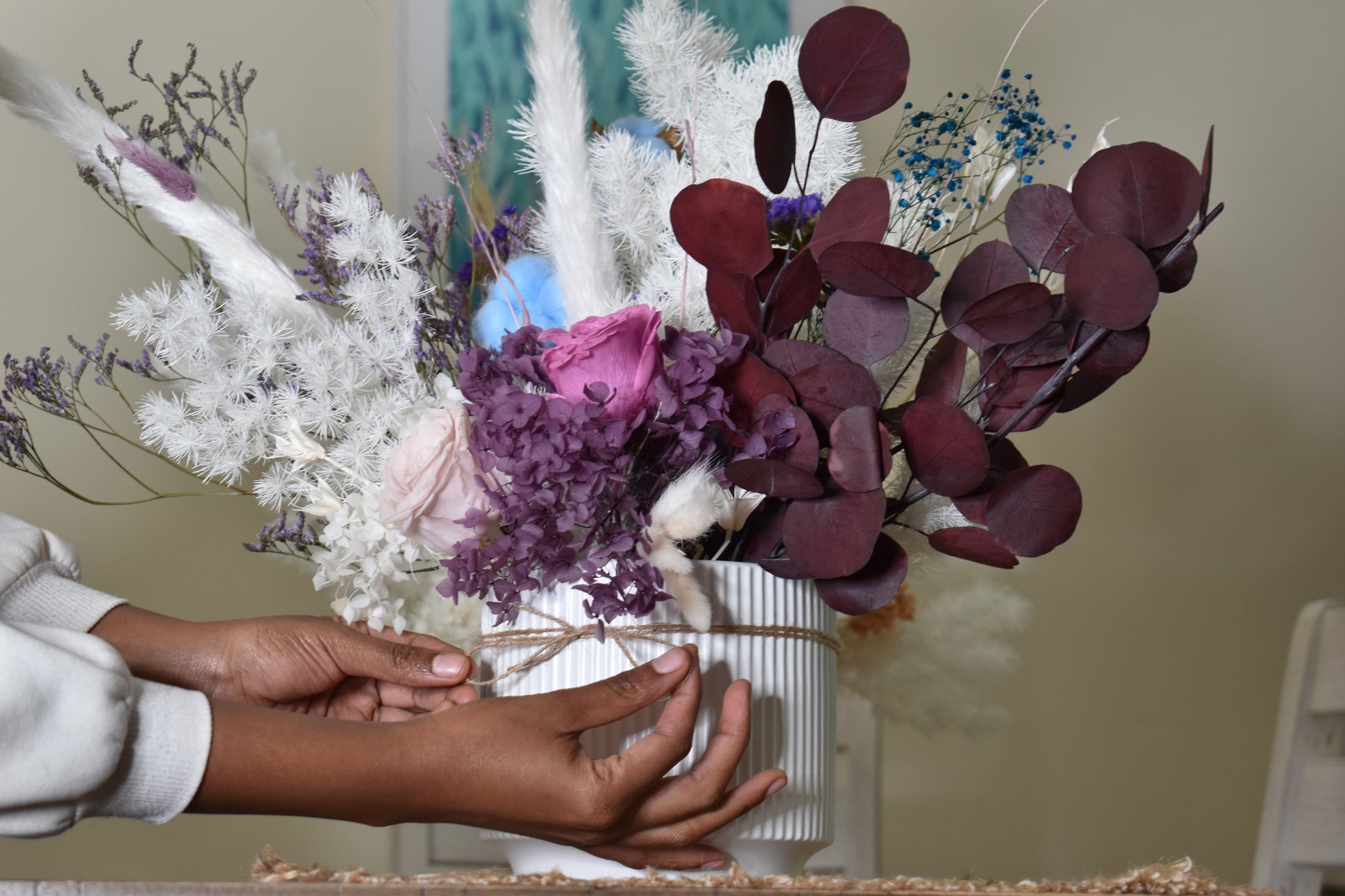 Dried flowers arrangement set from kenyan lady fleur on dining table.